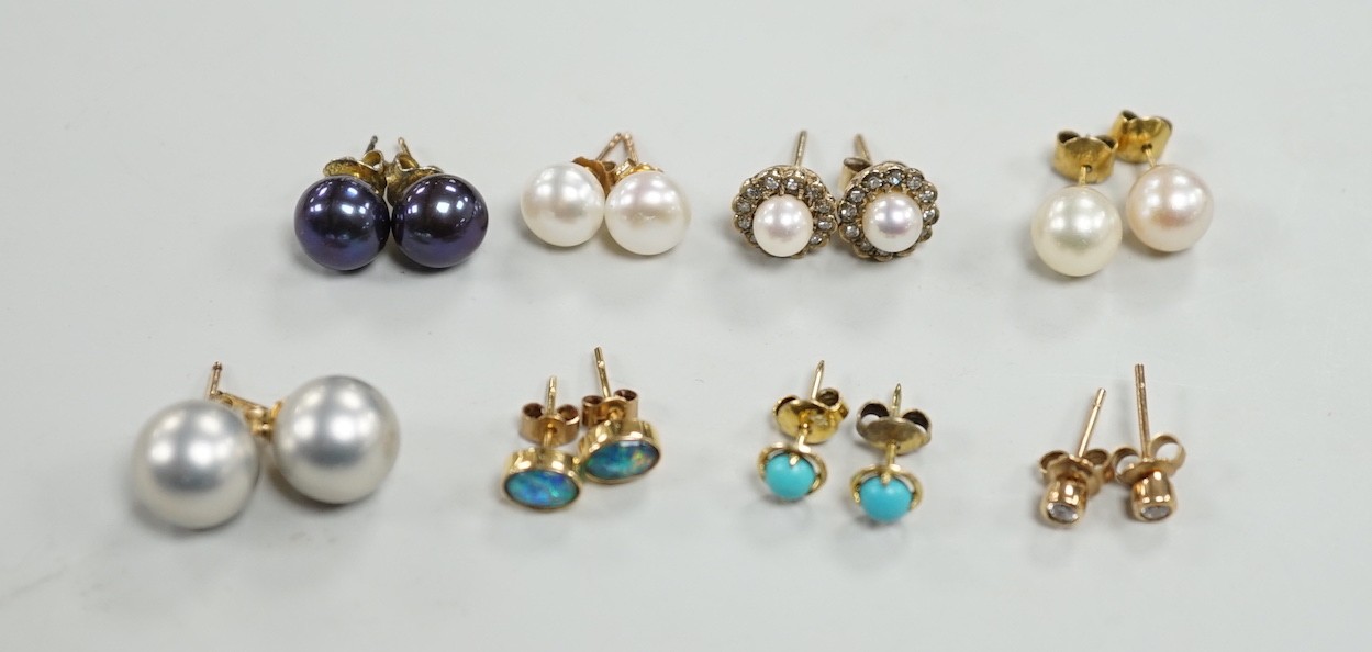 Eight assorted modern pairs of ear studs, including a 14k and cultured pearl and two other cultured pearl, one 9ct and diamond chip.